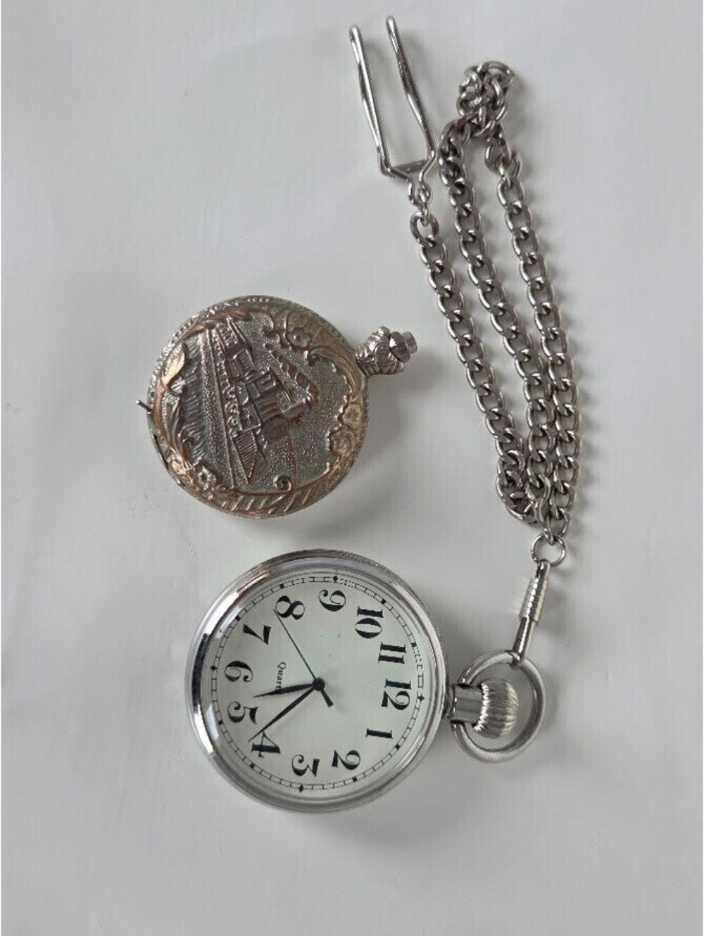 Lot of 2 Pocket Watches Quartz with Chains One Glass Front One Engraved Case